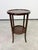 Add a touch of historical elegance to your interior with this beautiful antique side table with an integrated lower shelf,...
