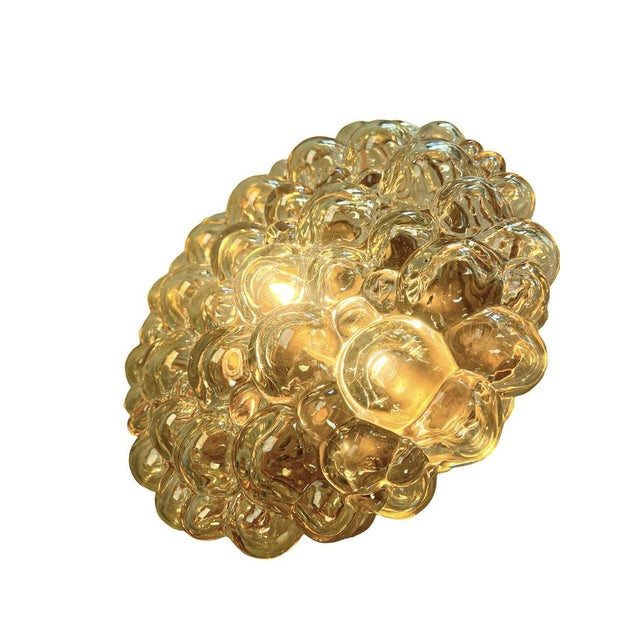 Mid Century Wall light or Flush Mount from iridescent amber bubble glass by Helena Tynell for Glashütte Limburg 1970s. The...