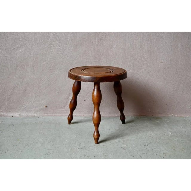 This small wooden stool is one of those authentic, rustic pieces of furniture we love. Its shape is simple and...