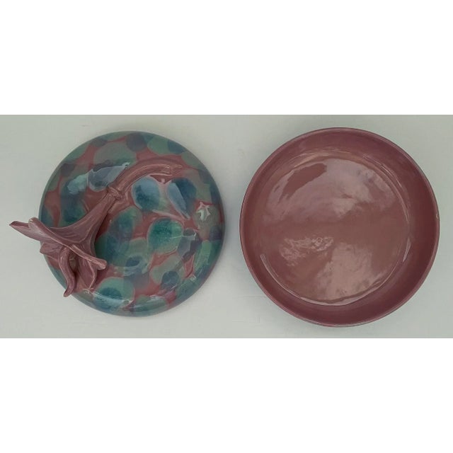Mid-Century ceramic dish with fitted lid by Royal Haeger. Exterior has mauve base color with interesting blue and aqua...