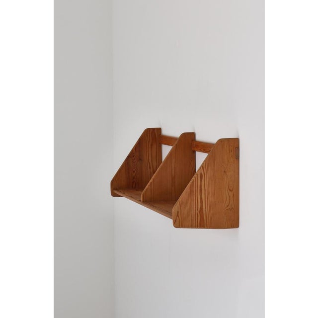 Rare Hans J. Wegner wall shelf made at Ry Mobler in Denmark in the 1954. Rare and early edition in pinewood. Stamped on...