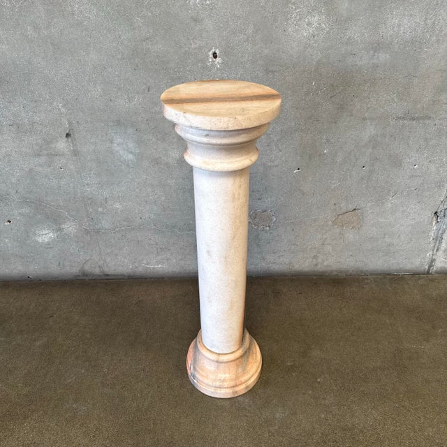 Add a touch of timeless elegance to your space with this exquisite vintage blush marble pedestal, crafted in Italy....
