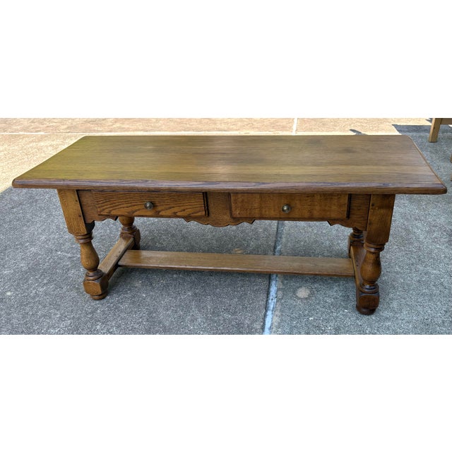 Very nice French country coffee table with two drawers. Solid wood!