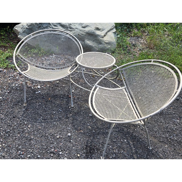 Salterini Radar Chairs and Table with Umbrella and Umbrella Base This vintage wrought iron Salterini Tete-A-Tete style...