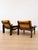 A pair of armchairs with a distinctive Scandinavian design from the 1970s. They feature a sturdy dark oak frame and a...