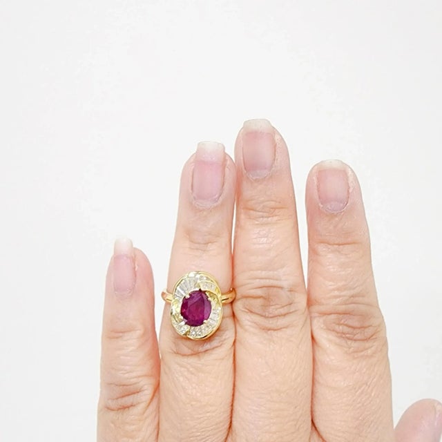 Beautiful 2.81 ct. Burma red ruby oval with 1.00 ct. of good quality white diamond baguettes. Handmade in 18k yellow gold....