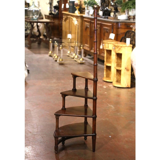 Combining traditional French craftsmanship with a practical spiral design, this vintage Louis XIII style library ladder...