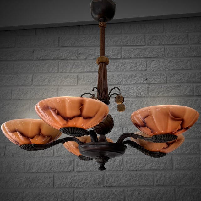 A beautiful Swedish Art Deco chandelier produced by an unidentified manufacturer in the 1930s. The chandelier features an...