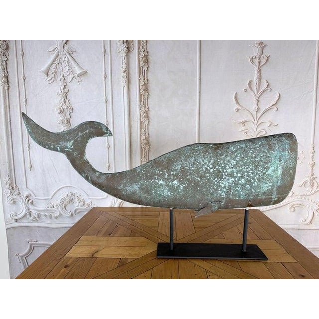Exceptional late 19th-century American Folk Art copper whale weathervane, mounted on modern iron display base. This is a...