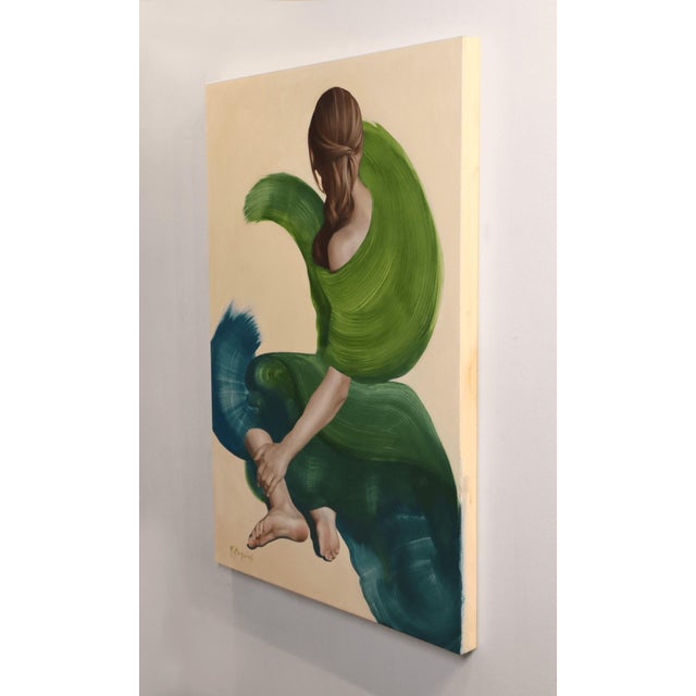 This artwork features a figure seated with their back to the viewer, draped in flowing green and blue brushstrokes that...