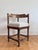 A pair of antique corner chairs in solid wood, likely beech, with a dark stained finish. These English chairs feature...