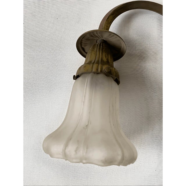 Good condition Add a touch of antique charm to your bedroom with this elegant vintage sconce. Featuring a graceful,...