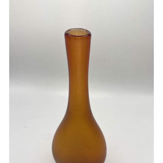The vases from paolo venini's incisa series are glass works of art characterized by deep, precise engravings on the glass....