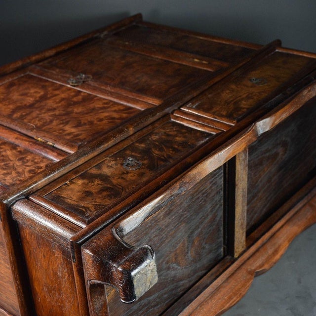 This is a gorgeous antique Chinese small cabinet crafted from solid Huali (Rosewood) wood. The most striking feature of...