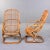 Found in Italy, this pair of rattan armchairs were designed by Tito Agnoli in 1959. Rectangular base with scoop-form seats...