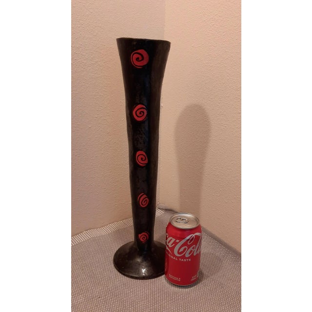 This original black tall studio pottery vase is signed "CM" on the bottom. The base features a black color with red...