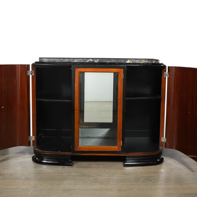 This elegant Art Deco Rosewood, Walnut & Black-Lacquer Bar Cabinet w/ Porto Marble Top & Bronze Pulls originates in...