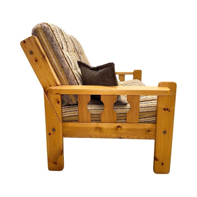 Vintage mid-century Scandinavian brutalist pine two-seater sofa from Europe. Features a striped tweed-like upholstery with...