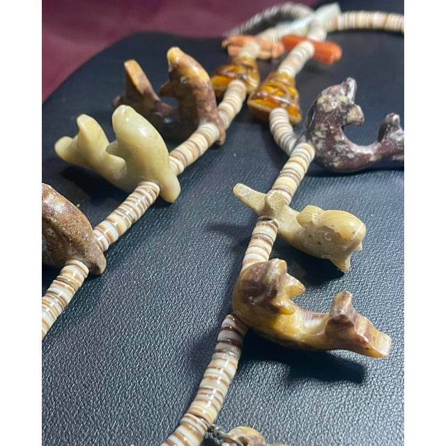 Magnificent carved stone older Navajo animal fetish style necklace, 23 inches in length and 81 grams. At its base rests...
