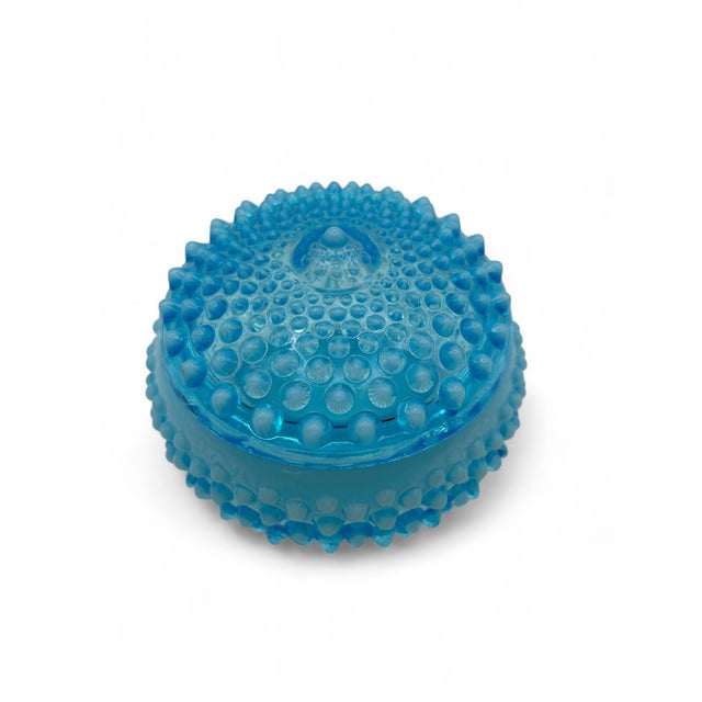 This charming 1940's Fenton Blue Opalescent Hobnail glass trinket dish is a delightful addition to any collection. The...