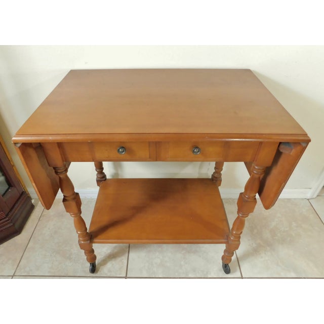 Beautiful vintage solid oak wood drop leaf rolling serving bar cart with drawer and shelf. Dovetailed construction. Made...