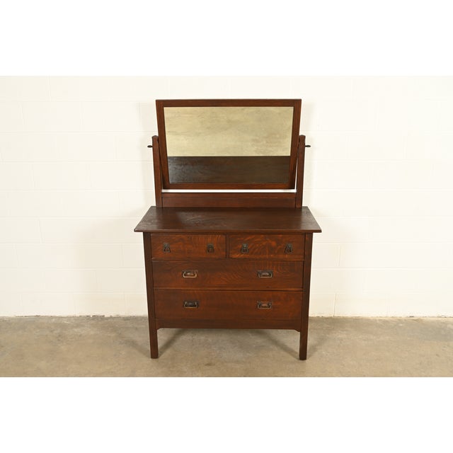 A rare and exceptional antique Mission or Arts & Crafts period four-drawer vanity dresser or chest of drawers with mirror...