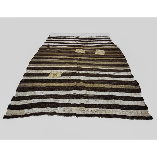 Vintage striped hand woven Kilim rug from Afyon region of Turkey. Approximately 50-60 years old. In very good condition