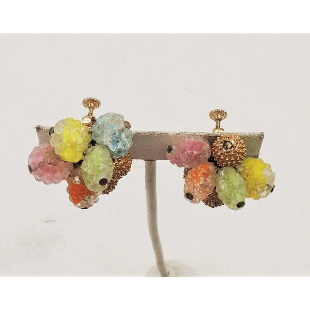 This is part of Chairish’s Costume Jewelry assortment. Textured goldtone beads and textured givre glass blue, yellow,...