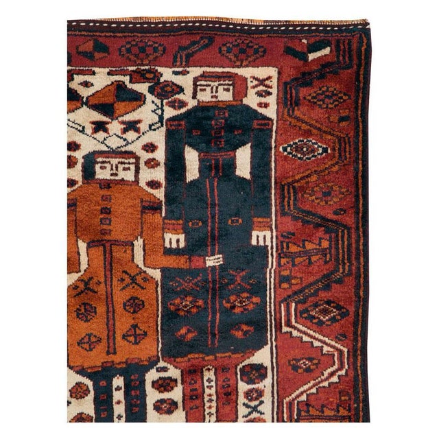 A vintage Persian tribal Bakhtiari accent rug handmade during the mid-20th century with a pictorial design. Measures: 4'...