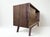 Elevate your space with this stunning Mid-Century Modern walnut credenza, a true testament to clean lines and timeless...