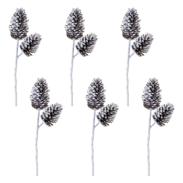 Bring the beauty of nature into your holiday decor with our Flocked Snowy Pine Cone Spray. Each 28-inch stem features...