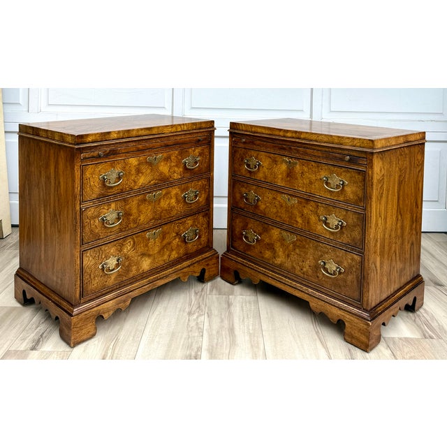 This handsome pair of vintage 1970s fruitwood nightstands features beautifully figured burlwood-style drawer fronts with...