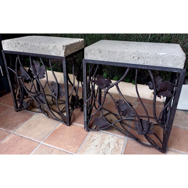 Two wrought iron and rough-hewn stone pedestals, perfect for entrances, plant stands, or outdoor side tables. These...