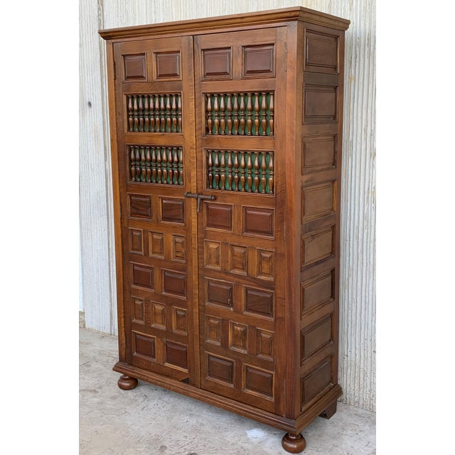 About Grand 19th century Spanish armario or wardrobe armoire constructed from walnut. Features a coffered case fronted by...