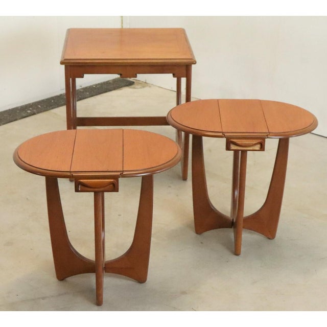 This unique set of nesting tables from G-Plan can definitely be called an owners favorite! The largest table is square and...