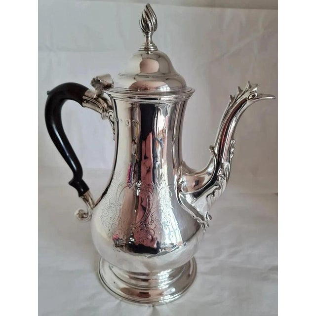An exceptional 18th-century english sterling silver coffee pot by thomas wallis i, hallmarked in london in 1771 during the...