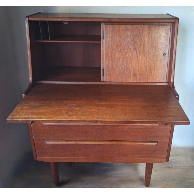 Teak secretary desk / bureau by AG Aarhus, Denmark 1960s. The desk has a pull-out writing surface and a hidden mirror...