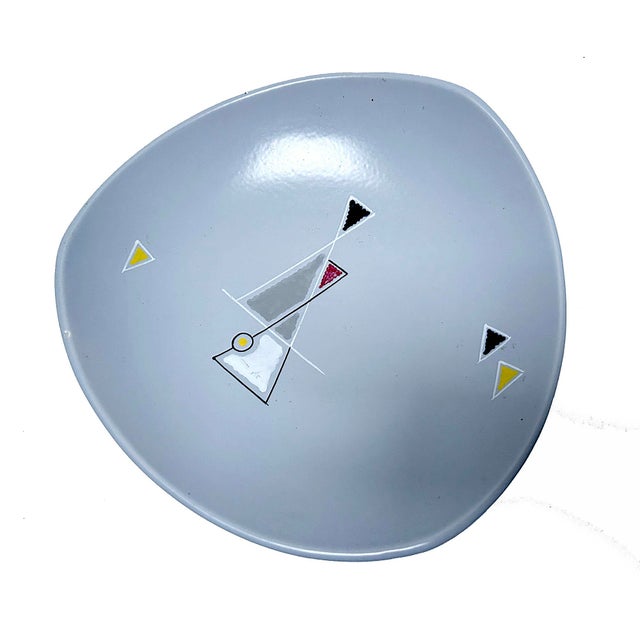 Mid-Century ceramic bowl by Gouda Holland with hand-painted pattern, convex and asymmetrical shape. This piece has an...