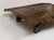 Beautiful hardwood strapped with decorative iron Formerly a camel cart - legs have been made from the original wheels...