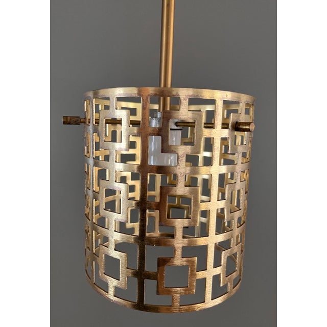 Vintage mid century modern gold tone drum shade pendant with pierced geometric design. American made and retaining the...
