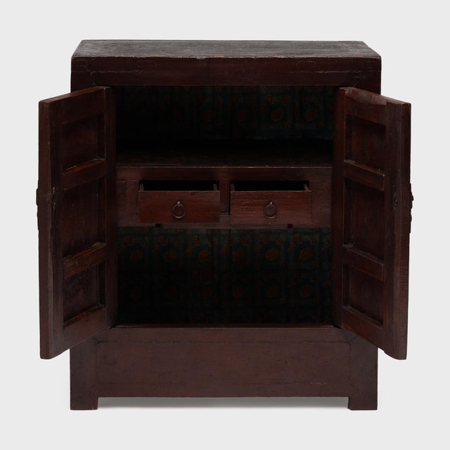This small Chinese locking cabinet from the early 20th century has a richly aged patina that only time can achieve. The...