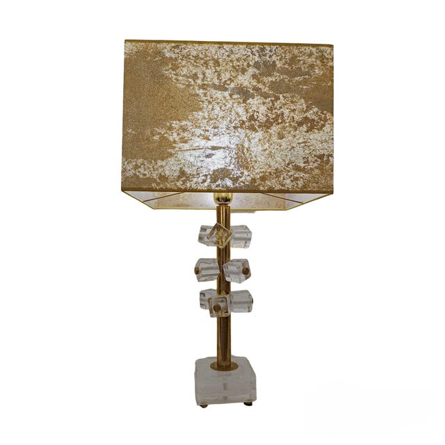 Pair of lamps made of Murano glass. The pieces feature a series of individual cubes in clear glass. Base finished in clear...