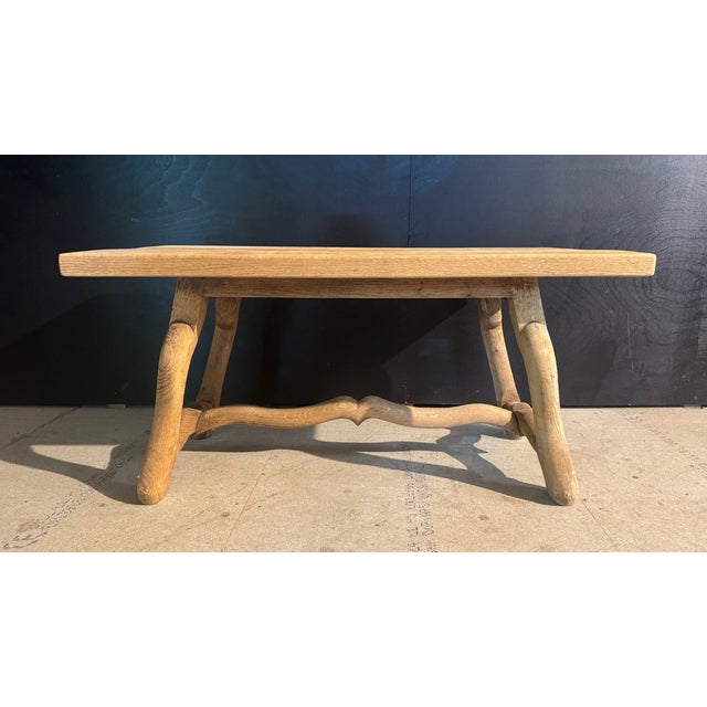 A charming French Oak Coffee Table having a lovely design mouton legs base. We have bleached it for a lighter look and in...