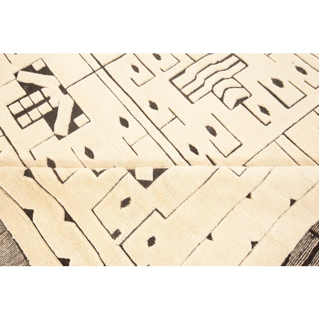 Evoking the timeless elegance of mid-20th century Scandinavian design, this modern Swedish Skvattram-style rug masterfully...