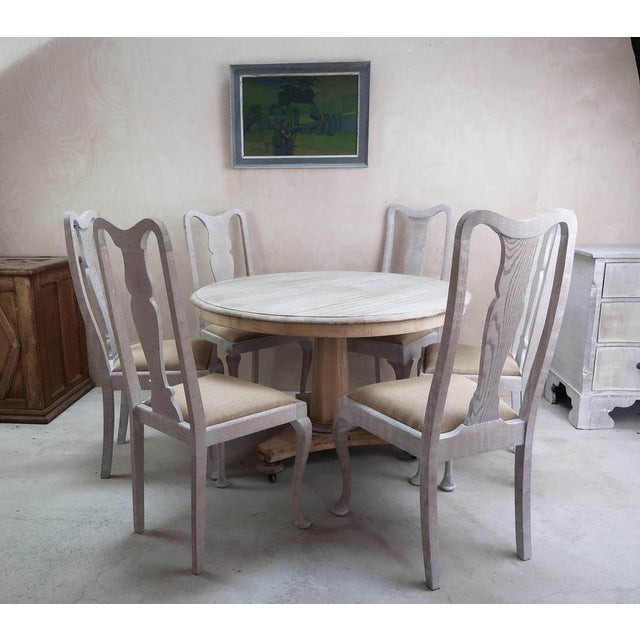A wonderful set of six English limed oak chairs. Not quite matching. They are actually 2 different models ( 3 + 3 ). The...
