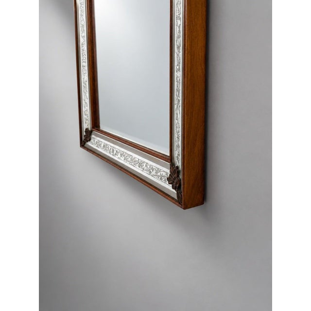 A refined vintage mirror with a beautifully understated presence, combining clear glass with a warm wooden frame. The...