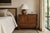 A distinctive pair of Danish oak cabinets attributed to Henning Kjærnulf, Denmark, circa 1960s. Crafted in richly figured...