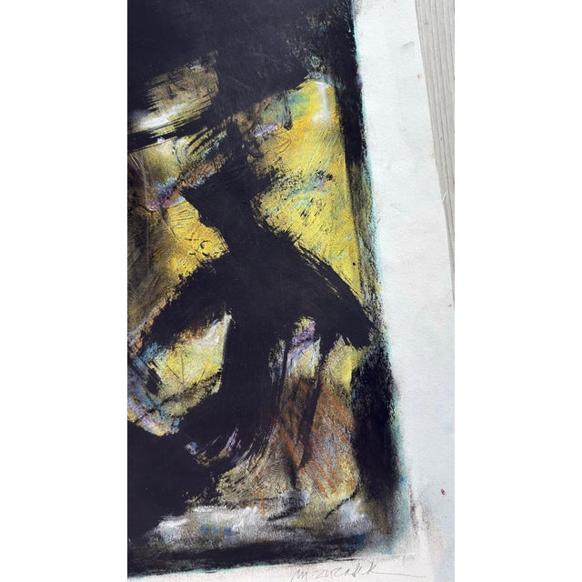 Raven — Monoprint with pastel and ink on paper, 18 x 24 in. Bold black gestures sweep across a luminous ground of gold,...