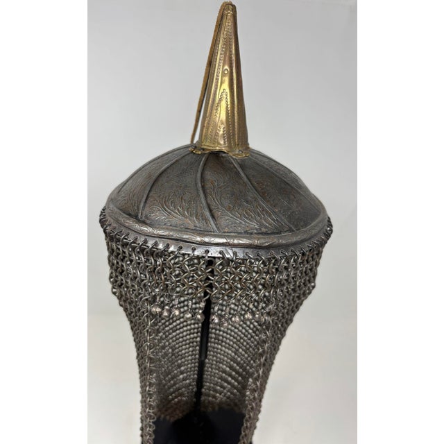 Indo Persian steel and brass Khula Khud Helmet. Central Asia, Indo-Persian culture, circa early 20th century. A fine...