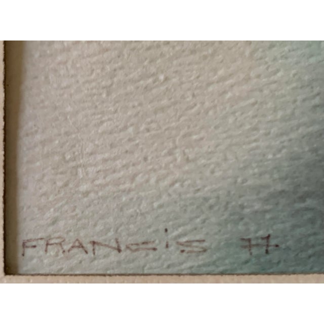 A vintage signed watercolor of branches of a tree blowing in the wind.